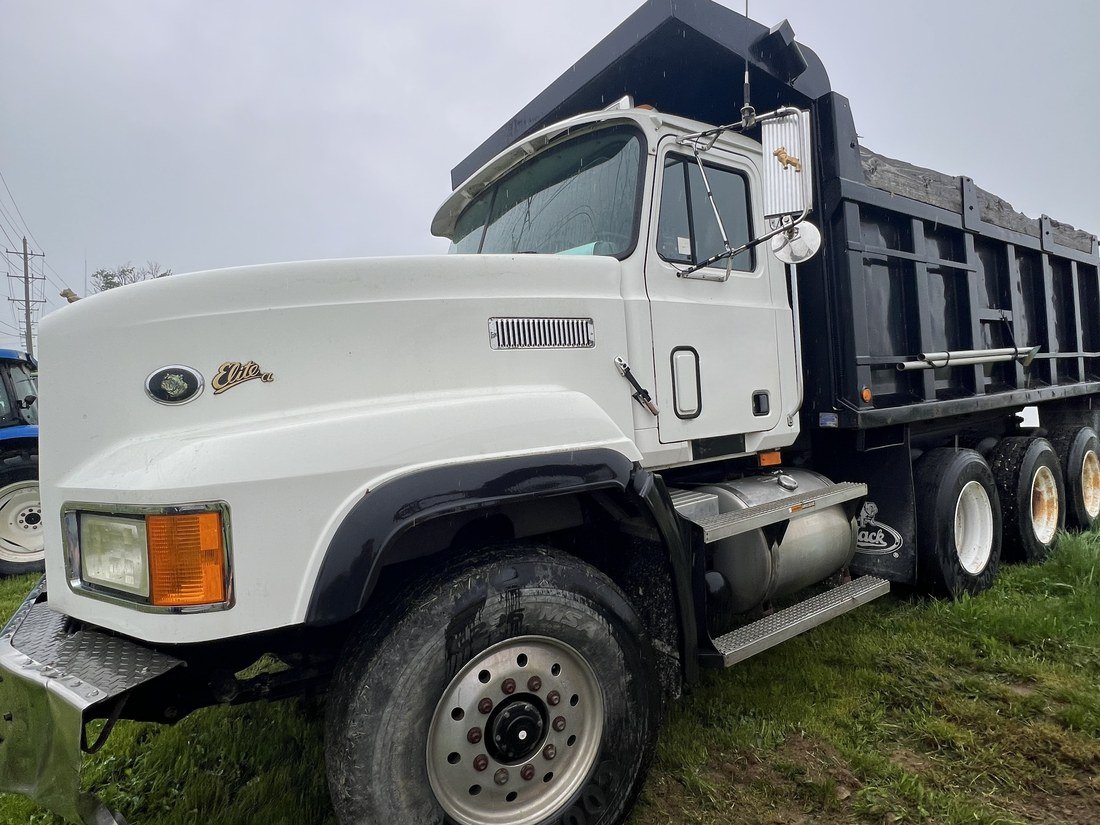 A tri-axle dump truck used to haul aggregate material.