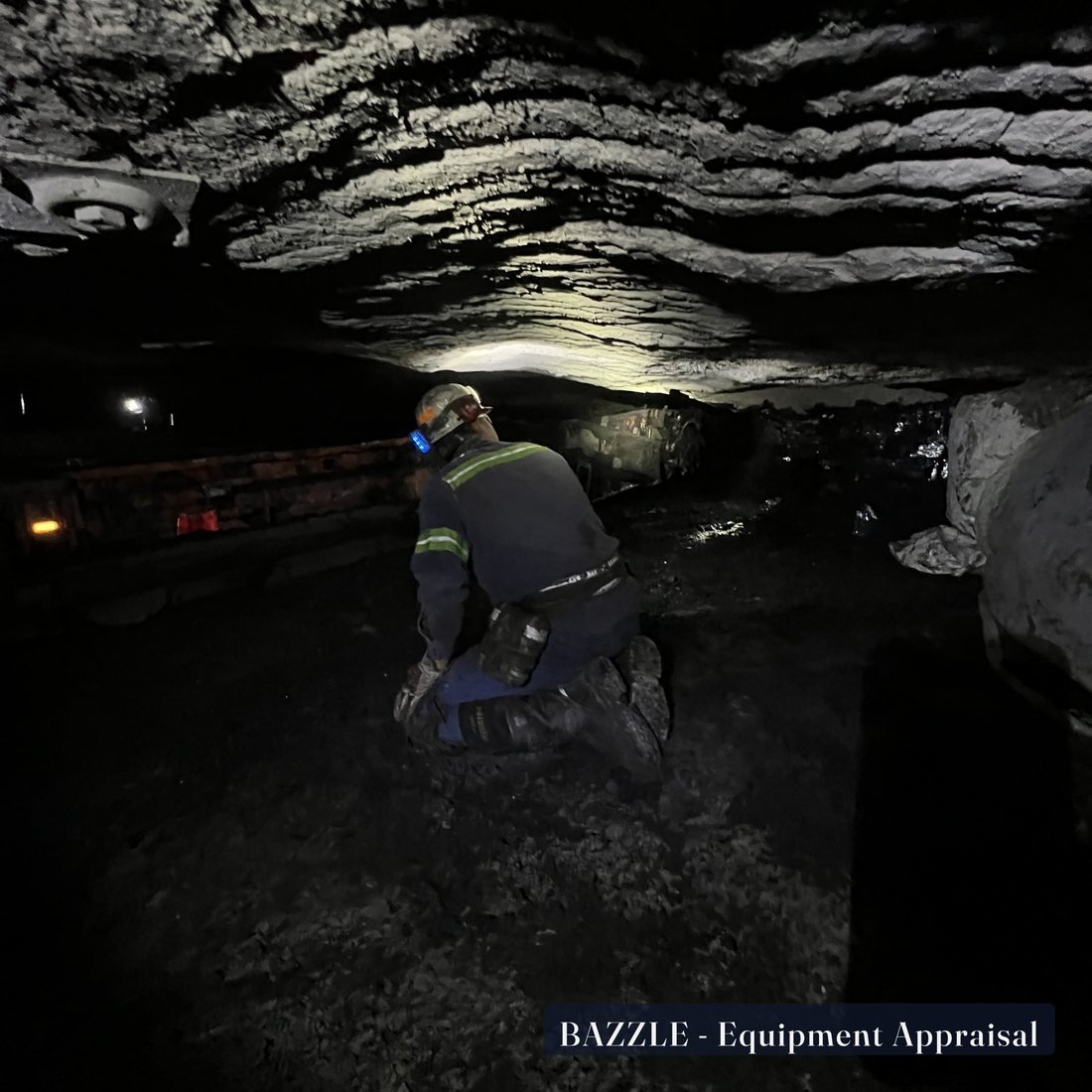 Nathan Bazzle inspecting equipment in an underground coal mine, Virginia
