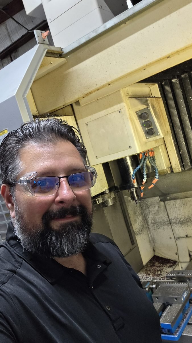 Nathan Bazzle on a CNC machining floor