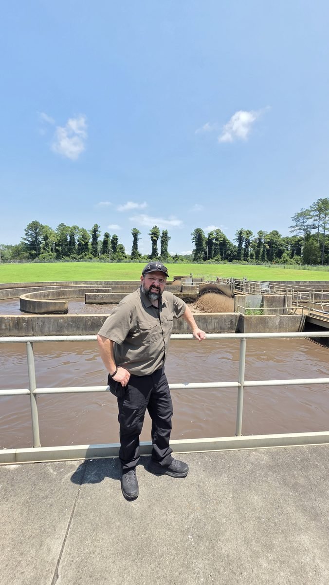 Nathan Bazzle inspecting a wastewater treatment plant