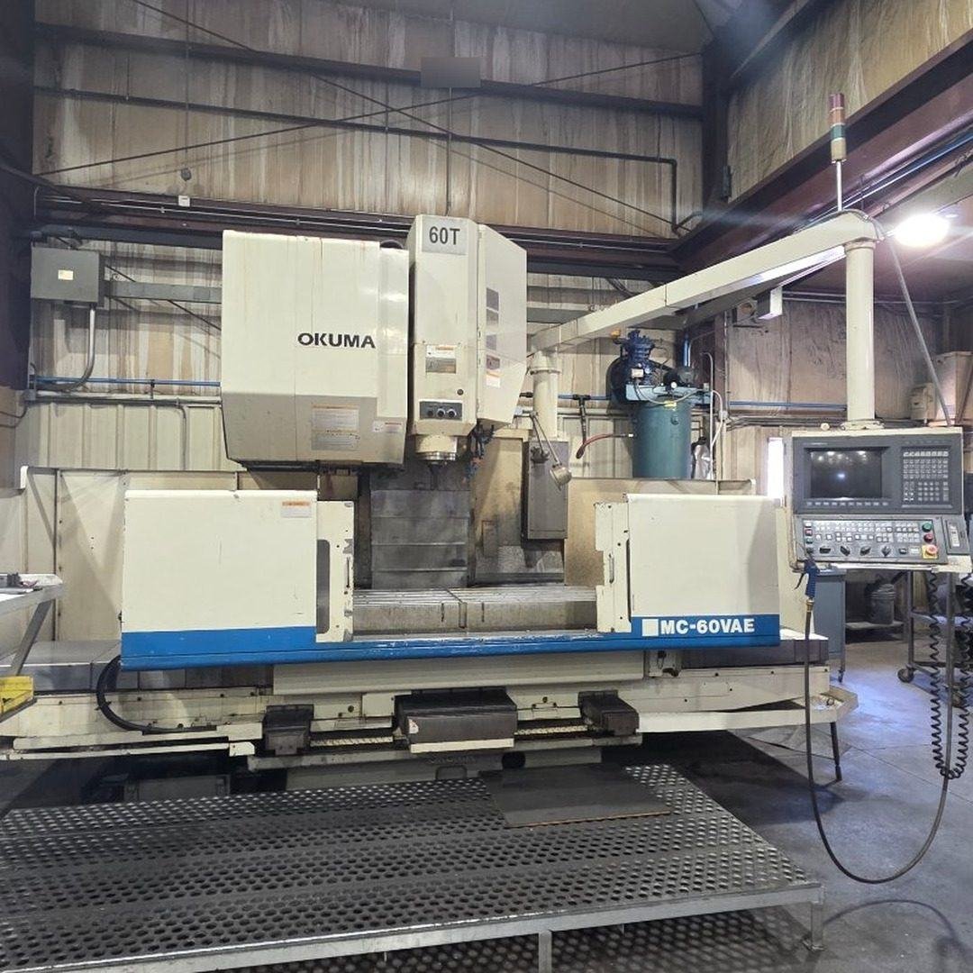 A CNC vertical machining center on a shop floor.
