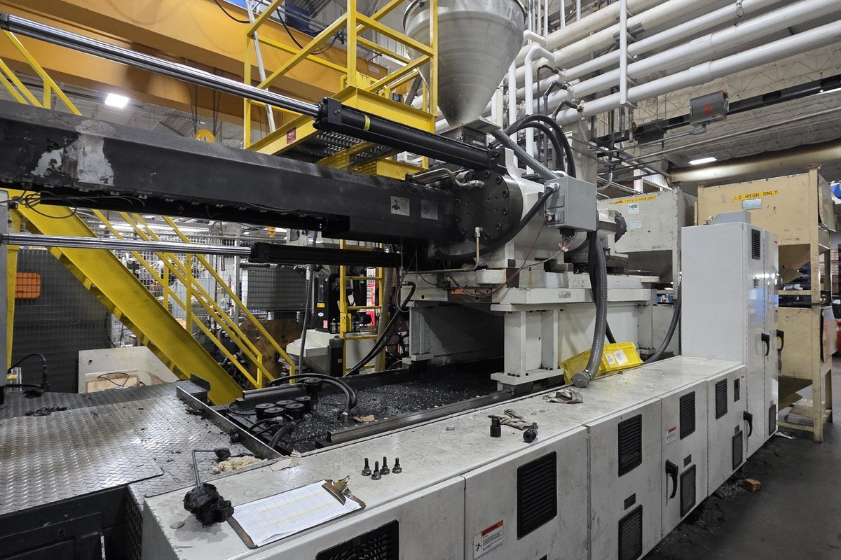 An industrial extrusion line inside a manufacturing plant.