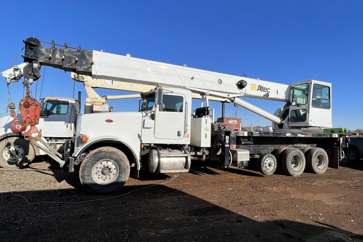 A truck-mounted well-servicing rig used in oilfield operations.