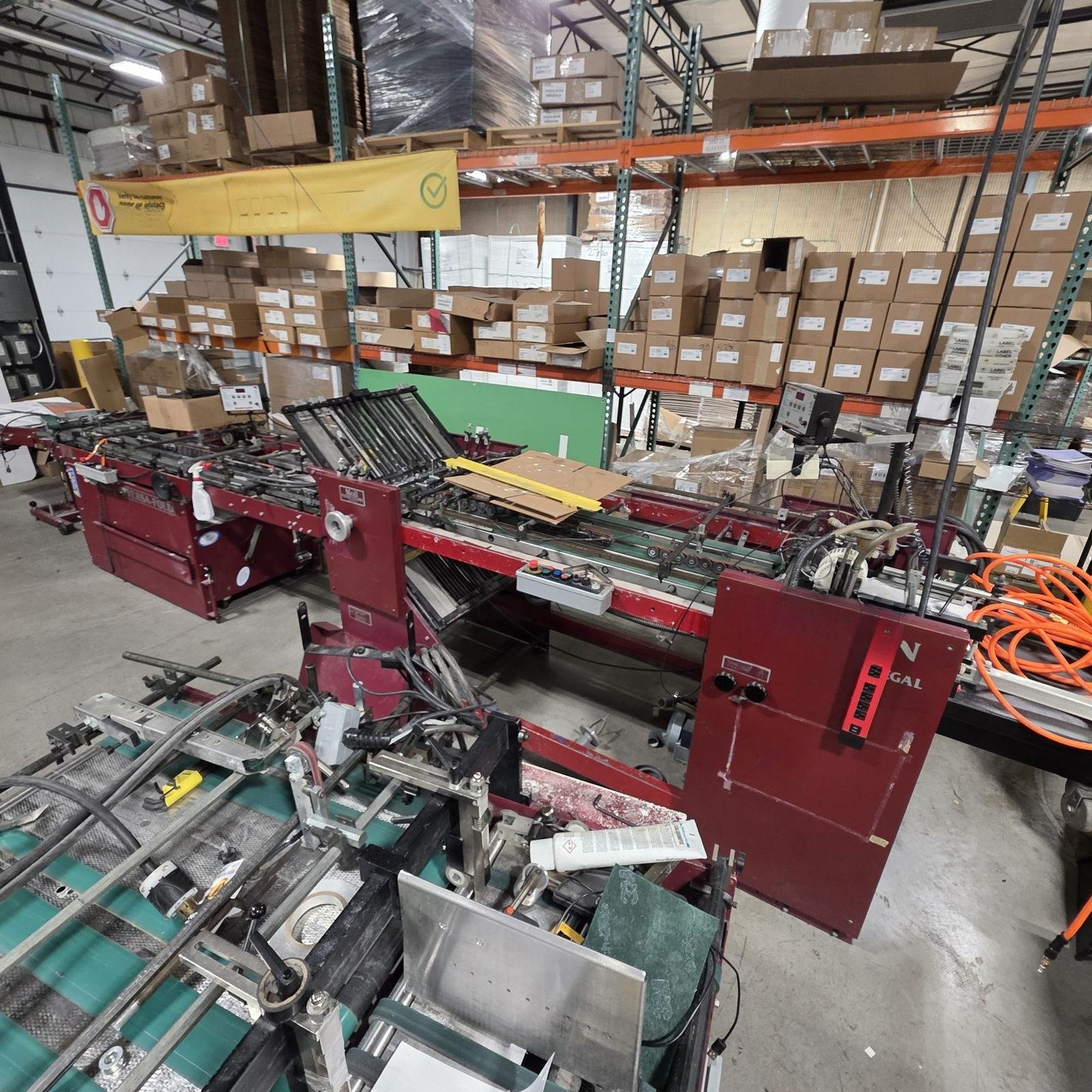 A finishing line with feeder and conveyor in a converting plant.